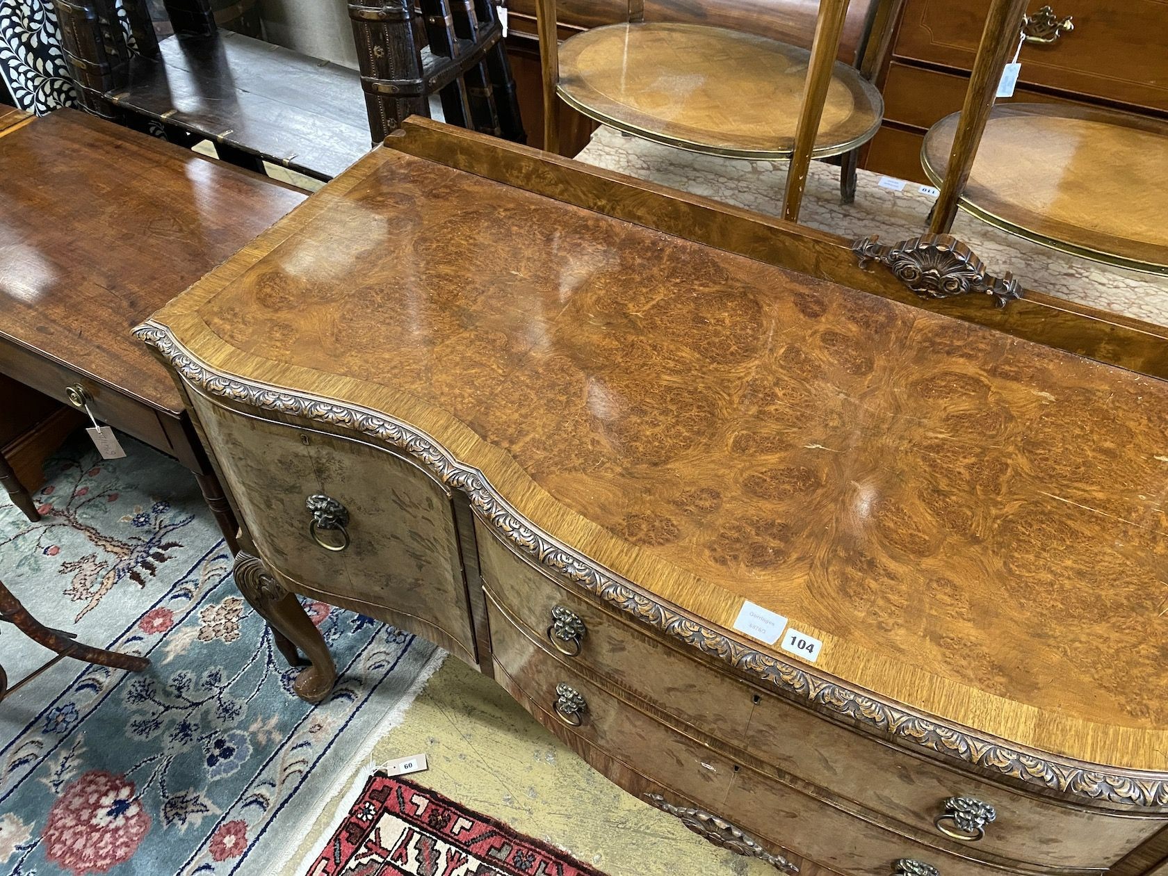 A Queen Anne revival banded walnut serpentine fronted sideboard, length 167cm, depth 56cm, height 99cm